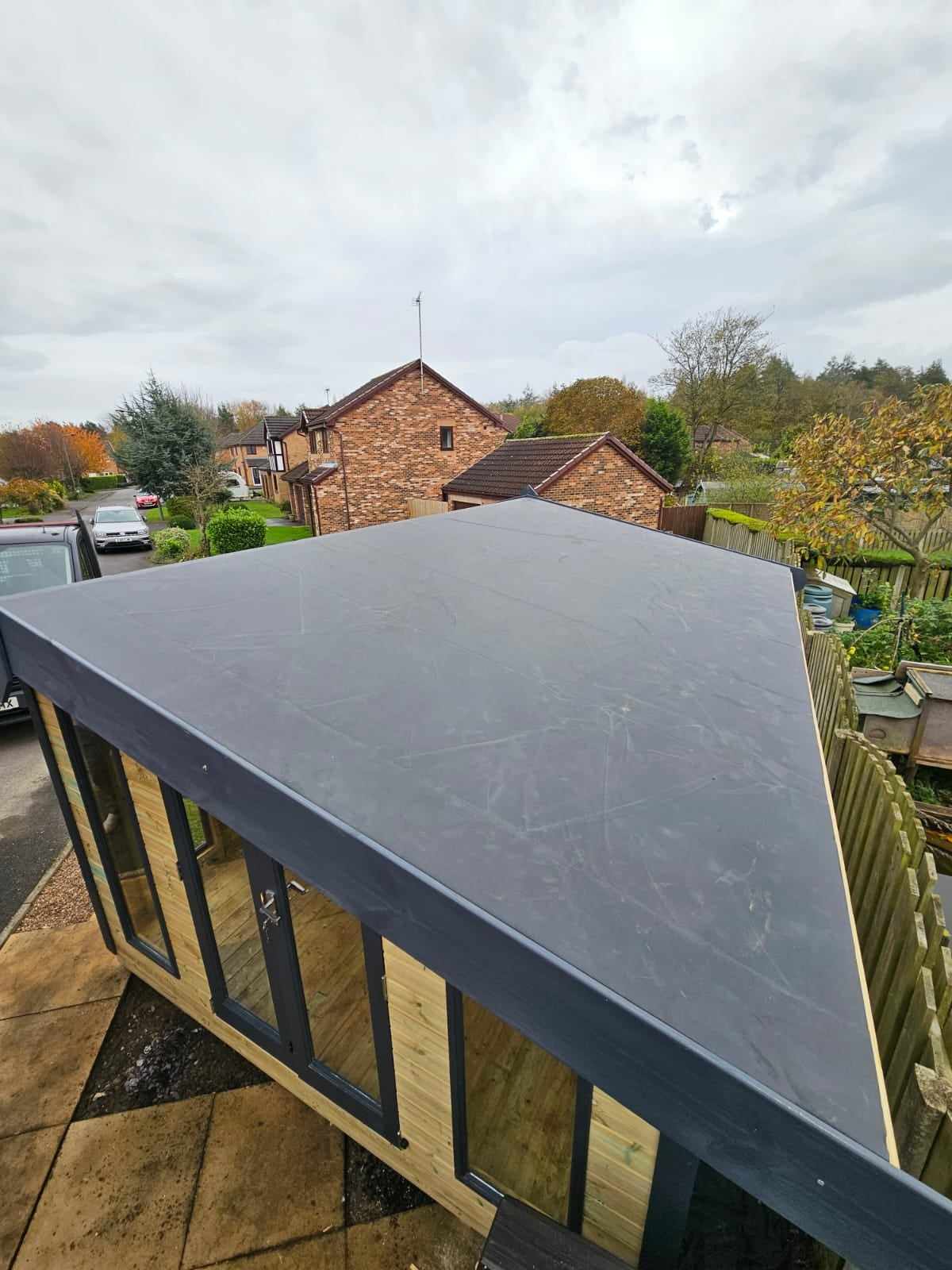EPDM rubber flat roof installation on a garden room